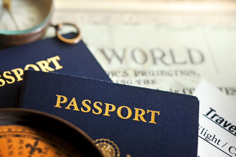 Image of two U.S. passports and a compass for a blog post covering what to do with a deceased person's passport.