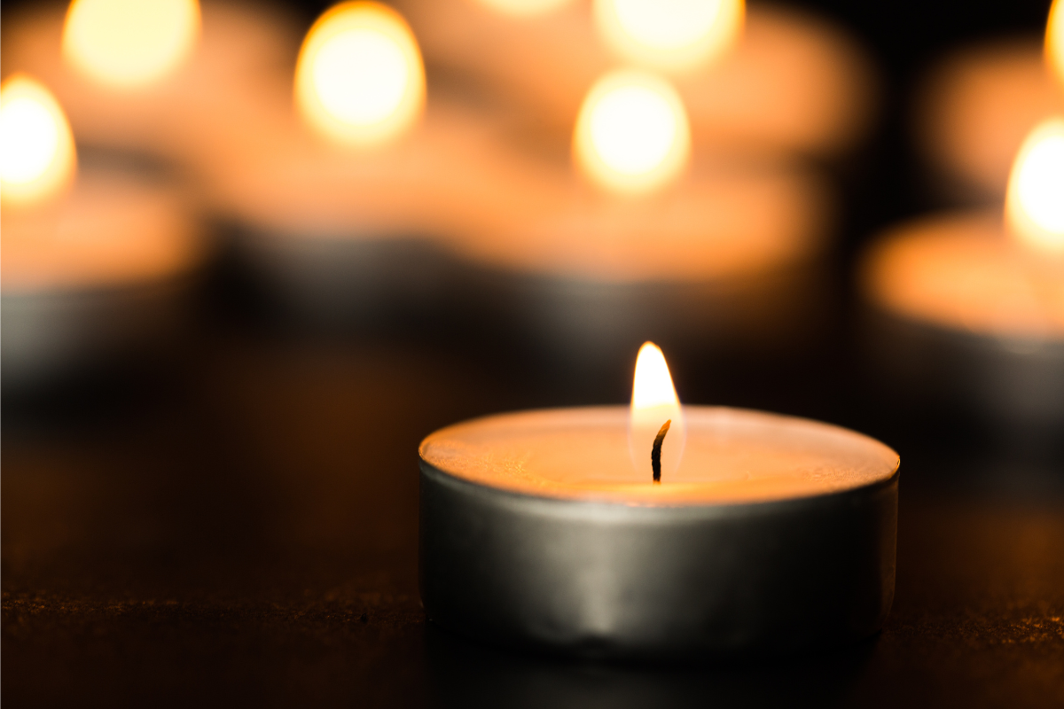 Image of a votive candle for a blog post covering the question, funeral or memorial service?