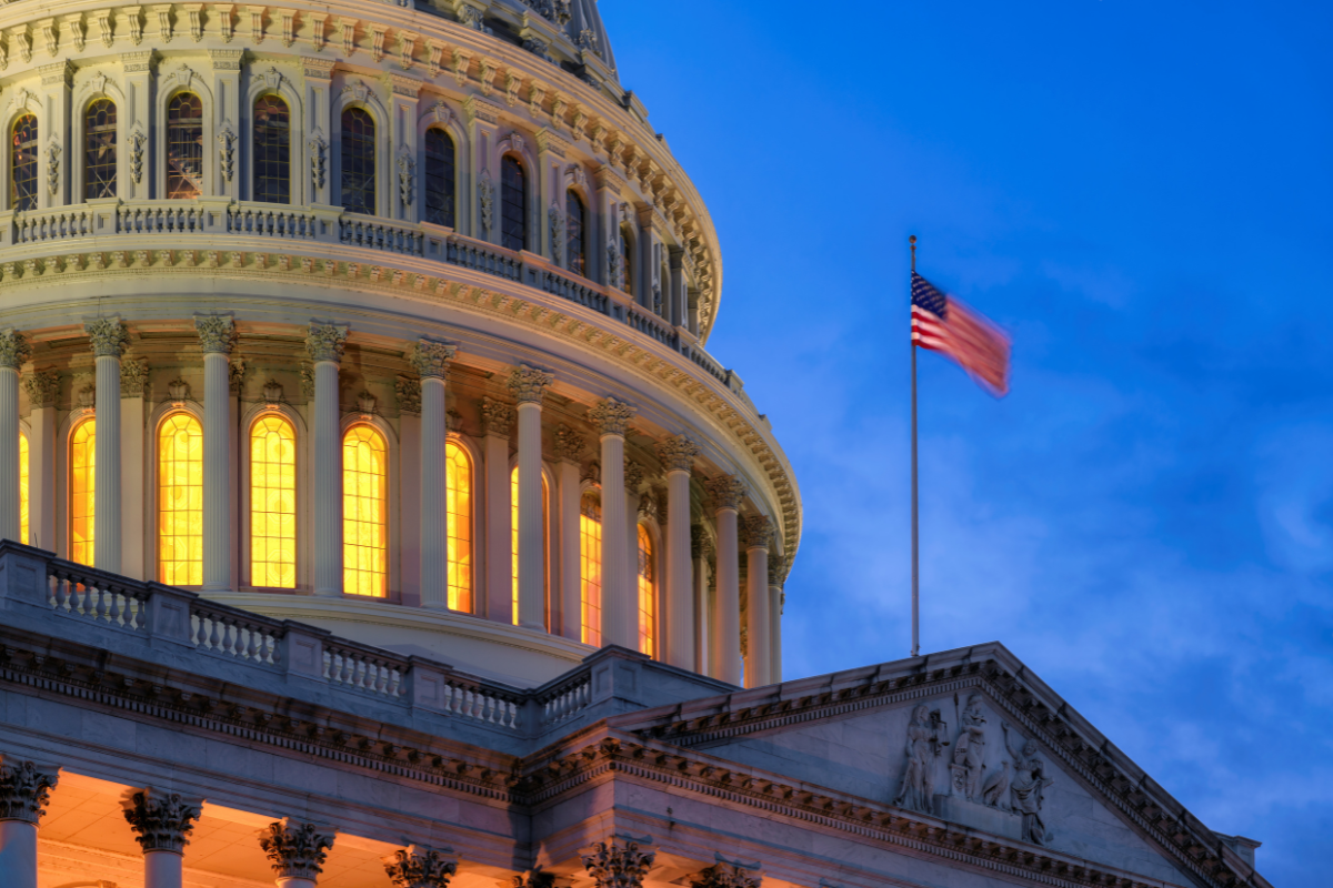 Image of the U.S. Capitol at night for a blog post covering reporting a death to U.S. Government agencies.