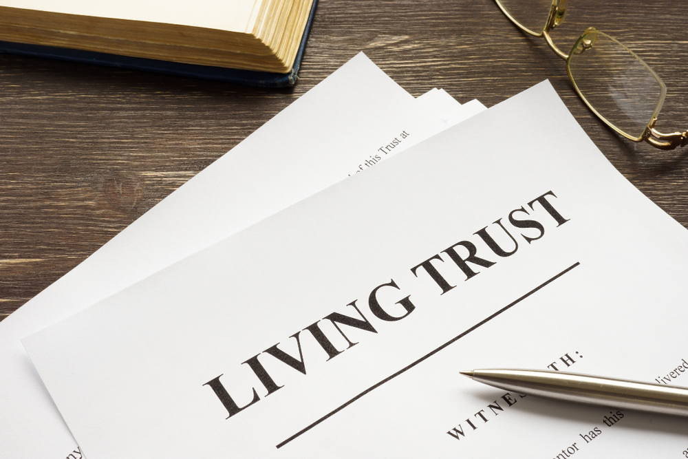 Image of a trust on a desktop for a blog post covering the differences between a revocable trust vs irrevocable trusts.