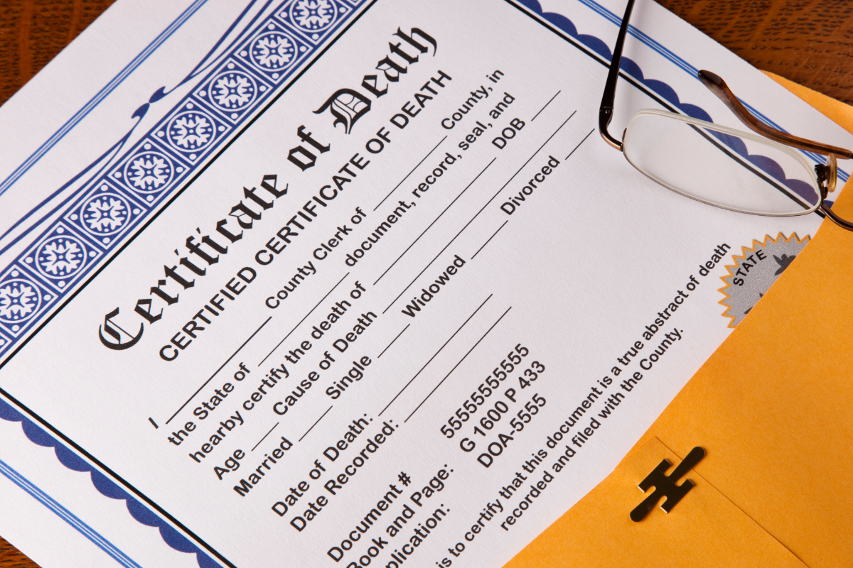 Image of a death certificate and a manila envelope for a blog post covering how to get a birth certificate.