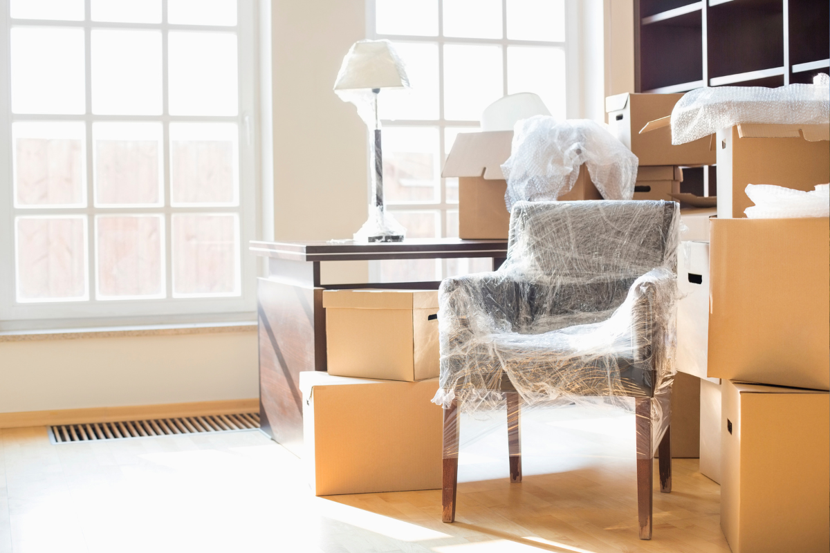 Image of packed up furniture and boxes for a blog post covering how to do an estate cleanout.