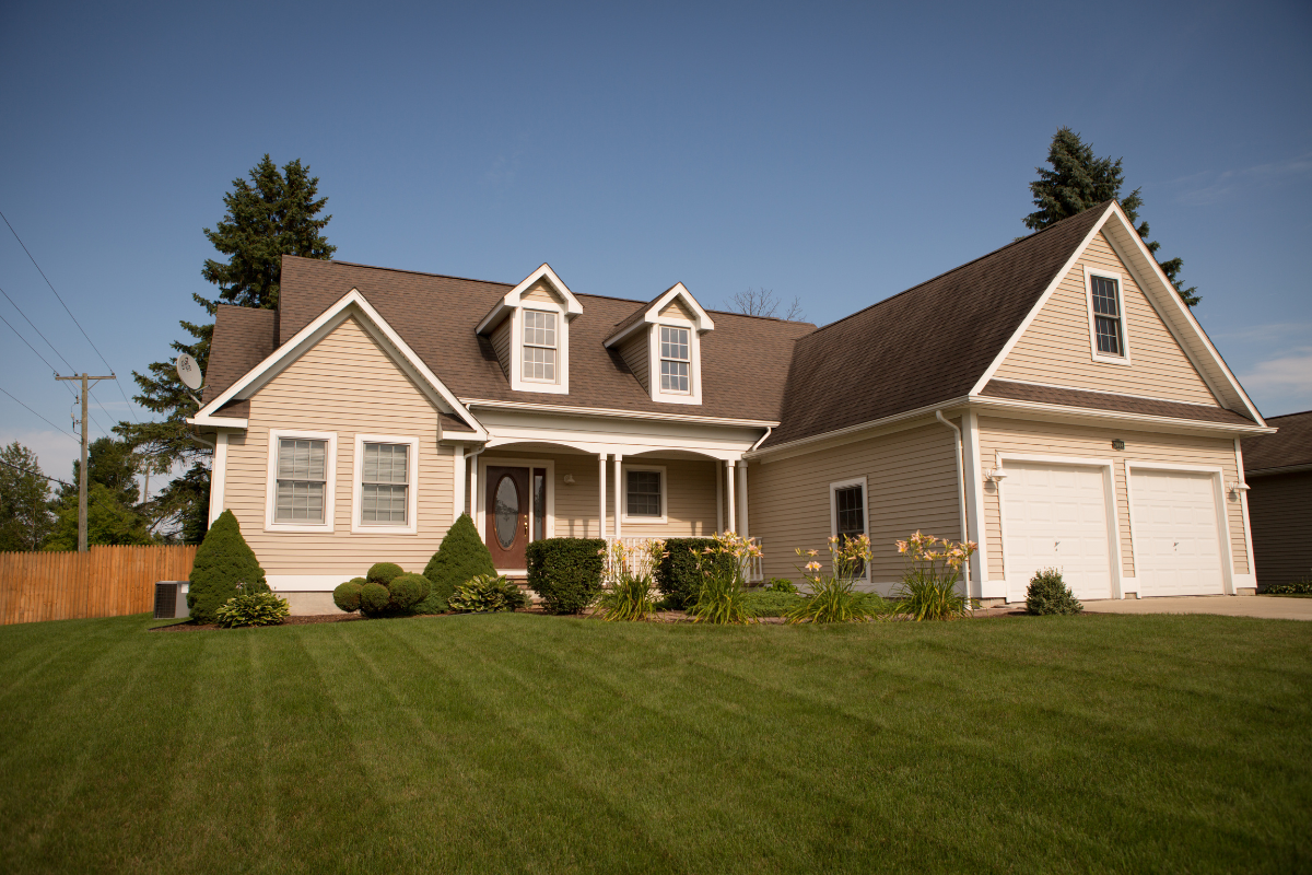 Image of the front lawn of a home for a blog post answering the question, "what is a Lady Bird deed?"